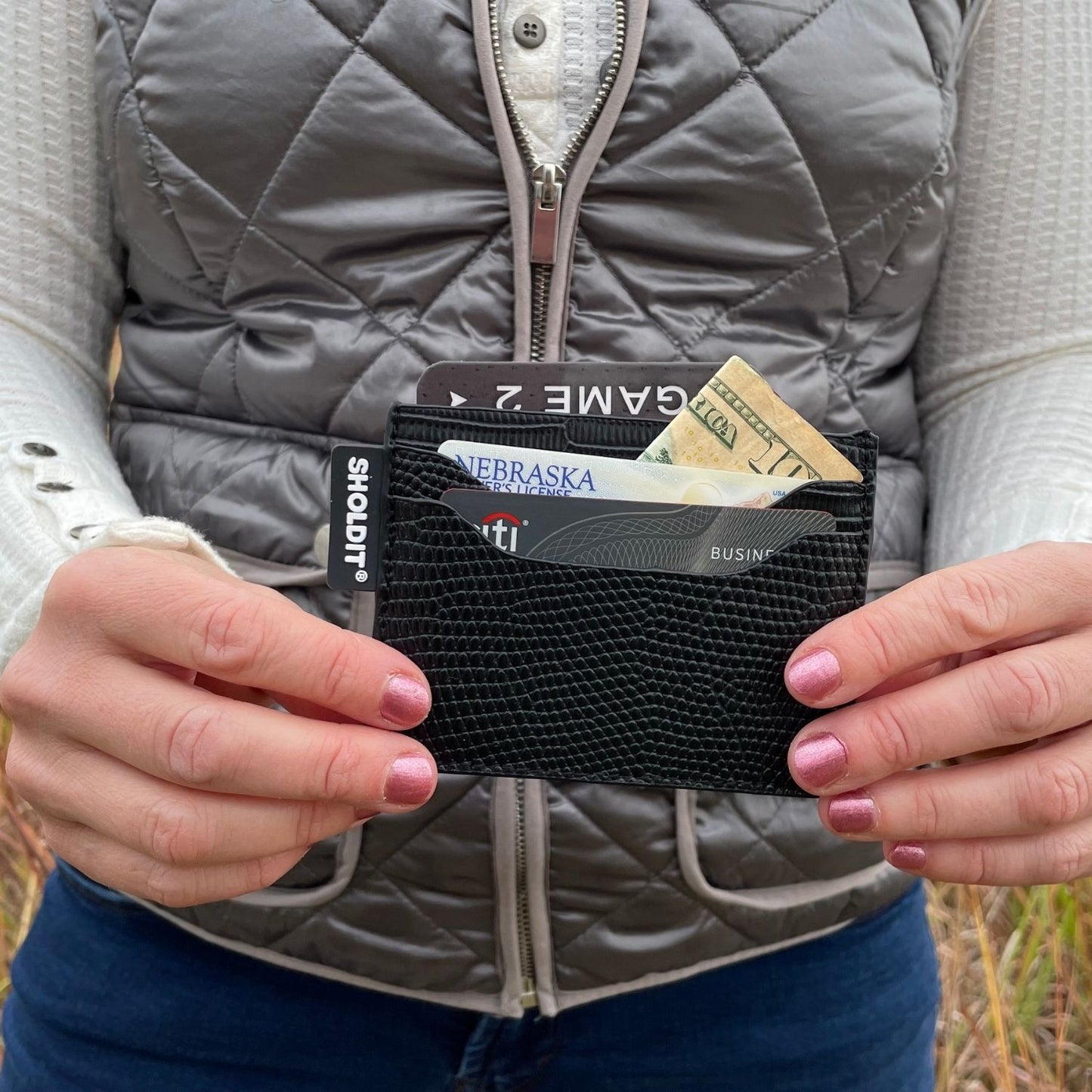 SHOLDIT card holder wallet black shown in hands